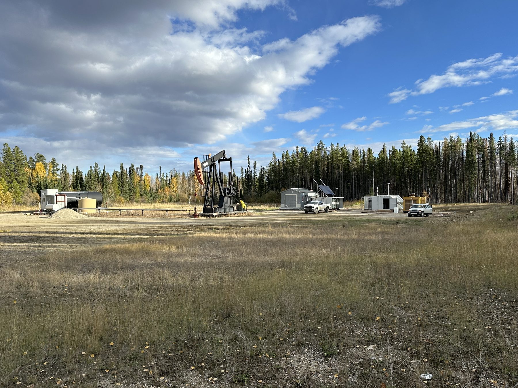 Pump jack and supporting infrastructure at a wellsite.